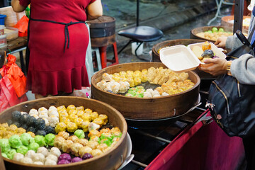 Variety of dim sum steamed in wooden container