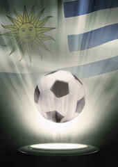 A soccer ball with Uruguay flag backdrop