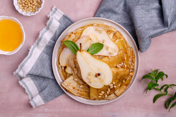 Crepes with pears, nuts and honey