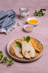 Crepes with pears, nuts and honey