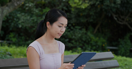 Obraz premium Woman use of digital tablet at outdoor