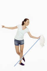 Woman dancing with a mop
