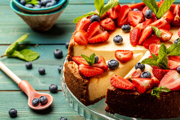 Homemade cheesecake with fresh berries and mint, healthy organic summer dessert pie cheese cake