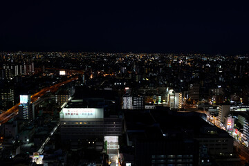 A bird's-eye view of Osaka's Minami district at night after sunset