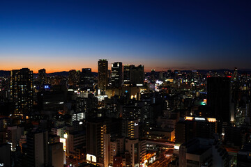 Fototapeta na wymiar A bird's-eye view of Osaka's Minami district at night after sunset