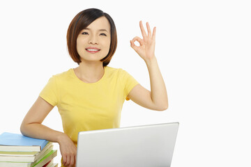 Woman with laptop showing hand gesture
