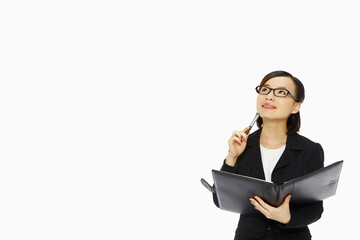 Cheerful businesswoman contemplating