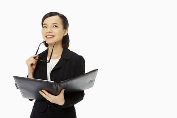 Cheerful businesswoman contemplating