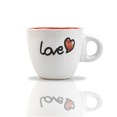 White ceramic coffee cup with red heart shape pattern and text LOVE isolated onwhite background. with clipping paths.