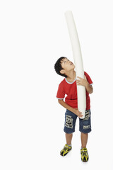 Boy playing around with a stack of disposable cups