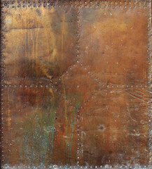 rusty and damaged metal plate with golden, brown, green and orange tones - worn steampunk...