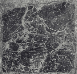 rough bright surface of a natural gray stone - texture with white lines over a dark gray background making primitive abstract figures
