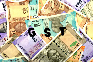 GST concept,GST alphabet on money background,business and financial concept idea,Indian Currency, Rupee, Indian Rupee,Indian Money, Business, finance, investment, saving and corruption - Image