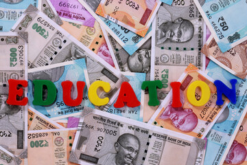 Education concept,Education alphabet on money background,Indian Currency, Rupee, Indian Rupee,Indian Money, Business, finance, investment, saving and corruption concept - Image