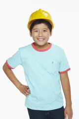 Cheerful boy with a construction helmet