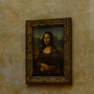 PARIS - APRIL 2, 2018: Mona Lisa in Louvre,  portrait painting by  Leonardo da Vinci  in Paris, France