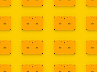Seamless pattern yellow tape cassette on yellow background.