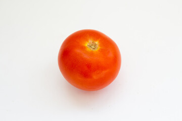 red tomato on a white background