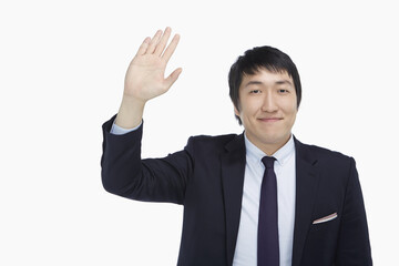Businessman showing a waving gesture