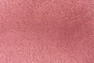 Light coral glitter twinkle abstract New Year or Christmas holiday background with sparkles. Modern luxury mock up with sequins. Texture of colored porous rubber with spangles