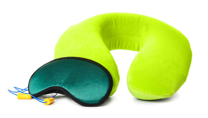 Travel pillow with sleep mask and ear plugs on white background