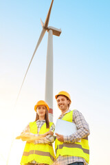 Engineers on windmill farm for electric power production