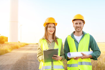 Fototapeta premium Engineers on windmill farm for electric power production