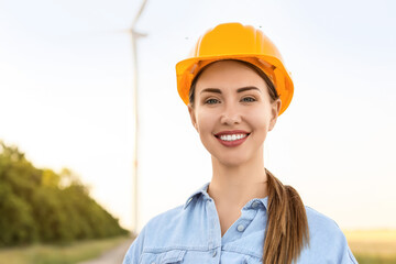 Female engineer on windmill farm for electric power production