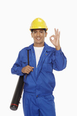 Construction worker showing hand gesture