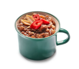 Cup of tasty lentils soup on white background