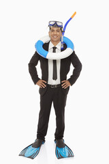 Businessman with swimming gear smiling