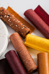 Sweet pure fruit pastille. Natural sweets from berries and fruits. Useful sweets are pastilles, fruit chips. Dietary vitamin nutrition. Vegan food.