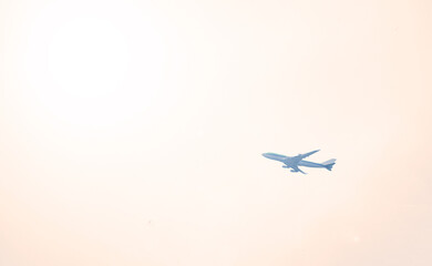 Naklejka na ściany i meble Airplane on a white sky background. transport