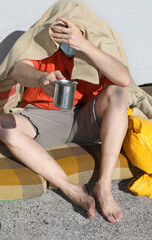 homeless man with dirty clothes and dirty legs asks the passersb
