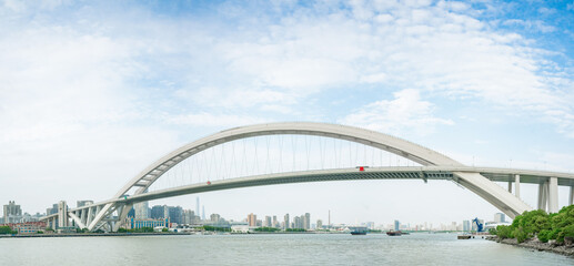 Panorama view of Lupu Bridge, on of the biggest bridge on Huangpu river, shot in Shanghai, China.