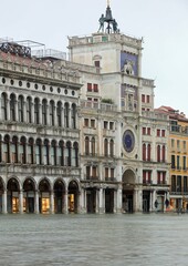 Fototapeta na wymiar Clock tower in Venice during the high tide
