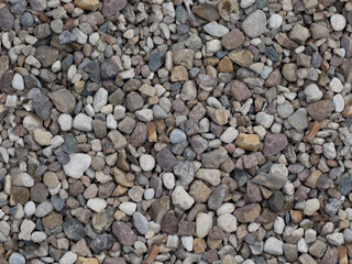 pebbles background. Many small and gray stones, seamless texture. seamless pattern of stones or gravel