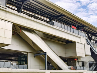 Fototapeta premium Architecture construction of elevator, escalator stairs and sky walk way, walk bridge between sky train station and department store mall