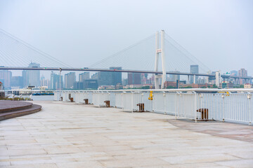 The expo park along the Huangpu River,  with Nanpu bridge in the back, shot in Shanghai, China.