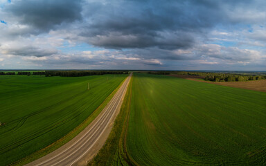 Obraz premium Top view of the road in summer evening. View from drone
