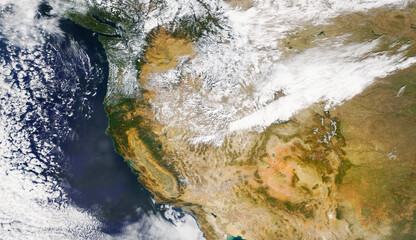 Satellite image of North America and the west coast with clouds. Elements of this image furnished...