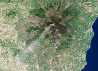 Satellite view of the volcano Mount Etna eruption in the island of Sicily.Elements of this image...