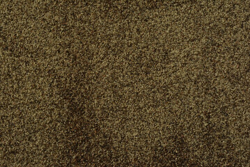 黒コショウと木のスプーン