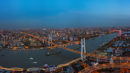 Aerial shot of Nanpu bridge in Shanghai, shot at sunset, in China.