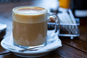 cup of coffee on wooden table