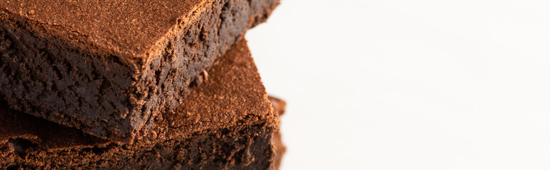 delicious brownie pieces on white background, panoramic shot
