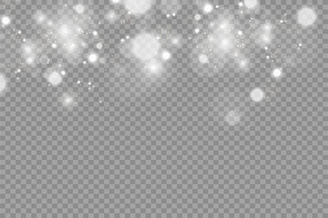 Vector sparkles on a transparent background. Christmas abstract pattern. Sparkling magical dust particles.