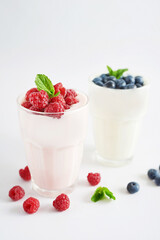 Yogurt cocktail and parfait. Natural detox. Liquid ice cream. Healthy food and breakfast. Good morning. Berry Milk Smoothie with blueberries, strawberries, raspberries. Fresh diet dessert. Summer card