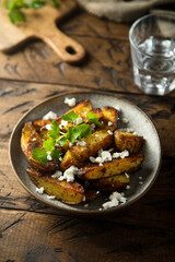 Roasted potato wedges with Feta cheese