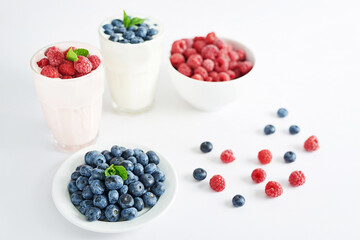 Yogurt cocktail and parfait. Natural detox. Liquid ice cream. Healthy food and breakfast. Good morning. Berry Milk Smoothie with blueberries, strawberries, raspberries. Fresh diet dessert. Summer card